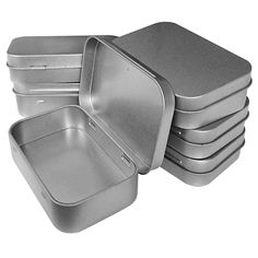 a set of six stainless steel pans with lids