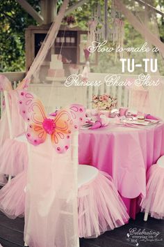 there is a table with pink tulle chairs and a butterfly chair cover on it