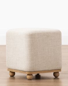 the foot stool is made out of wood and has wheels on one side, while the rest