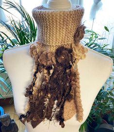 Bohemian style shawl/flexible neck collar with beautiful  beige-brown colors crochet flowers and big crochet tassels/all seasons cloak/knitting wrap, scraf/handmade woman top throw/picture is ready to ship Picture shawl was crochet for gray colors  and  is ready to ship. A beautiful and unique hand knitted shawl in ivory-brown colors. Lovely touch, light, warm and perfect wear every day. Soft and  yarn is made from: %10 Wool  %90 Acrilic Dimensions of finished shawl: neck part is flexible Size: front  length: 35cm/14inch Please note that due to lighting effects, monitor's brightness, contrast and other settings, there might be some slight differences in the colour tone/shade of the web site's photo and the actual item. Shipping terms: We send our parcels with fast shipping worldwide ..  Af Bohemian Cream Scarves For Winter, Handmade Bohemian Cream Scarves, Handmade Bohemian Cream Scarf, Bohemian Brown Crochet Scarf, Crochet Tassels, Big Crochet, Shawl Neck, Hand Knit Shawl, Knitted Shawl