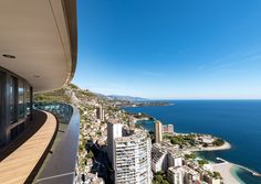 a balcony overlooking the ocean and city