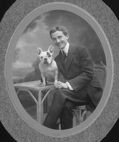 a black and white photo of a man sitting with his dog on a chair in front of him