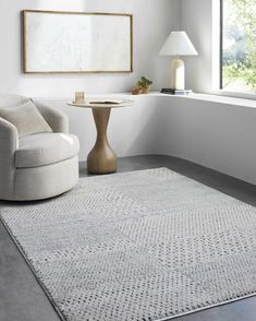 a living room with white walls and furniture