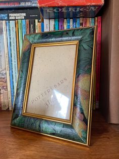 a wooden shelf with books and a framed photograph on it, next to a bookcase full of books