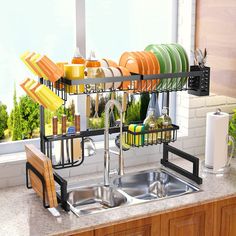 a kitchen sink filled with dishes and utensils in front of a counter top