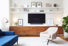 a living room filled with furniture and a flat screen tv