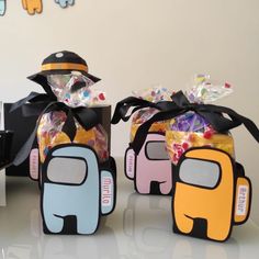 two bags filled with candy sitting on top of a table