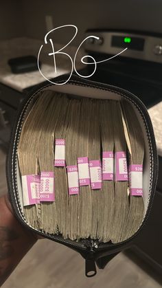 there is a bunch of hair on top of a bag with pink tags attached to it