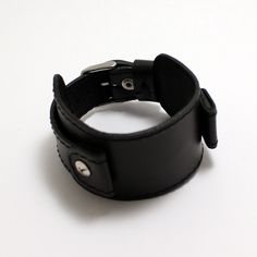 Top Side Series black brutalist leather strap with wide pad 4 cm wide. Strap attached with screws so you can use this strap with non-removable lugs also you can change distance between attachment points. Available springbar sizes from 18 till 24 mm. Technical info Narrow part - 18 mm/20 mm depend on springbars Wide part - 40 mm x 130 mm Total length - 245 mm Buckle - stainless steel Suitable for standard lug sizes 18 x 40 mm 20 x 45 mm 22 x 45 mm 24 x 48 mm To understand secondary size - you nee Black Leather Cuff Watch Bands, Series Black, Leather Watch Strap, Wide Cuff, Watch Strap, Leather Watch, Watch Bands, Smart Watch, Leather Bracelet