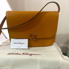 Gancini Rounded Flap Shoulder Bag. Comes With Dust Bag. Detachable, Adjustable Strap. Designer Tan Flap Bag For Travel, Salvatore Ferragamo Handbags, Ferragamo Bag, Salvatore Ferragamo Bags, Ferragamo Handbags, Beige Bag, Flap Shoulder Bag, Vintage Shoulder Bag, Top Handle Handbags