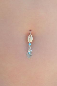 "A feminine and delicate Hamsa belly button ring made with dangling Swarovski crystal beads. This navel piercing is handmade of a 14k gold filled or Silver hoop, Hamsa hand pendant, Cowrie shell pendant, and blue Opal stones. The Hamsa (or Hand of Fatima) is a middle-eastern symbol of good luck, said to keep evil spirits away. Wear it or give it to a loved one to use as an amulet to give protection and good luck. Do not hesitate to contact me for special requests and customization! ♥♥ In a hurry Dangle Belly Ring As Gift, Sterling Silver Dangle Belly Rings For Gift, Nickel Free Sterling Silver Dangle Belly Rings, Nickel-free Dangle Belly Rings In Sterling Silver, Nickel-free Sterling Silver Dangle Belly Rings, Dangle Body Jewelry For Gifts, Handmade Dangle Body Jewelry For Gifts, Handmade Dangle Body Jewelry As Gift, Adjustable Dangle Belly Rings