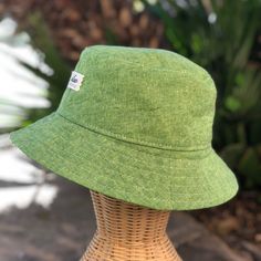 The perfect summer bucket hat! Made from a grass green colored linen blend fabric. This hat is very comfortable to wear. A great sun hat for women or men. I made this hat with a day of adventure in mind, somewhere sunny and wild! This hat is made from a grass green linen and cotton blend fabric.  Inside liner is white cotton. Interfacing inside brim for extra shape.  Brim measures approx. 2.5" wide. Crown measures approx. 3.5" deep. Available in sizes: S - measures 22.5" (fits heads with circumf Green Bucket Hat, Custom Fitted Hats, Teen Summer, Baby Sun Hat, Sun Hats For Women, Hat For Women, Grass Green, Summer Gift, Beach Accessories