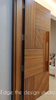 an open wooden door in the middle of a room