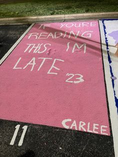 a parking lot with chalk writing on it