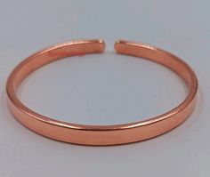 Welcome to my shop, Copper Cuff Bracelet, Handmade Smooth Bracelet, Fashion Copper Cuff Bracelet, Unisex Cuff, Christmas Gift, Anniversary Gift, Gift for Her Handmade item Ships from a small business in India Materials: Copper Jewelry Type :- Bracelet Metal :- Pure Copper Style :- Bangles Size :- All Size Available Occasion: Best Friend Gifts, Deco Handmade Jewelry, Gift for Girlfriend, Rings For Women, Solid Silver Ring, Gift For Valentines, Bridesmaid Gift, Engagement Gift Ring, Jewelry Gift For Her, Valentine Day Gift, Labor Day Gift, St. Patrick's Day Gift, Easter Day Gift, Halloween Jewelry, gift, Spring Summer Trends Design, Thanksgiving Gift, Copper Jewelry, Deco Handmade Jewelry, Christmas Gifts, Birthstones Gift Jewelry, Best Friend Gifts, Bestseller Bridesmaid Gift, cuff bracelet Adjustable Band Bangle As Gift, Adjustable Band Cuff Bracelet As Gift, Cuff Bracelets Handmade, Copper Cuff Bracelet, Copper Cuff, Bracelet Fashion, Birthstone Gifts, Copper Bracelet, Halloween Jewelry