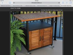 an image of a wooden table with wheels on the front and back sides that are attached to a balcony railing