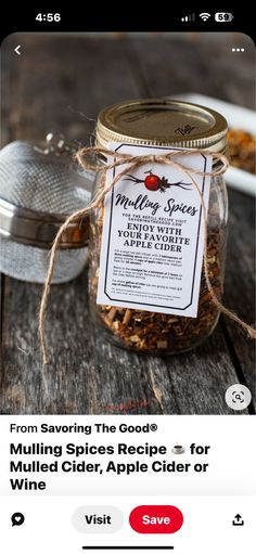 a jar filled with mulling spices sitting on top of a wooden table