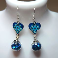 These Are 14mm Glitter Balls With Sterling Silver Coated Hooks. Sparkling Blue Earrings For Gift, Party Silver Heart Earrings With Beads, Sparkling Blue Dangle Earrings, Blue Heart-shaped Earrings For Party, Sparkling Blue Round Jewelry, Blue Heart Drop Earrings, Blue Heart Earrings For Valentine's Day, Blue Earrings For Valentine's Day Party, Blue Heart-shaped Earrings For Valentine's Day