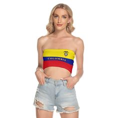 a woman in ripped shorts and a top with the flag of colombia on it's chest