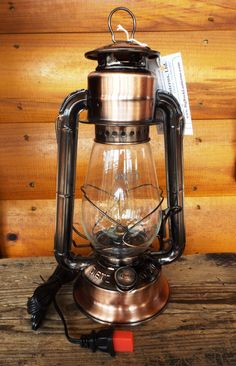 an old fashioned lantern is sitting on a table