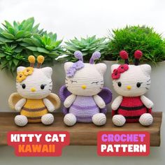 three crocheted hello kitty dolls sitting on a shelf next to potted plants