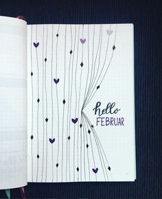 an open notebook with hearts on it and the words hello february written in black ink