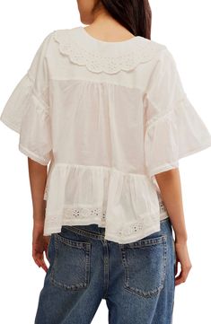 Dainty eyelet dials up the delight of an airy top cut from pure cotton. 20 1/2" length Front button closure Plunge neck with shawl collar Elbow-length sleeves 100% cotton Machine wash, line dry Imported Chic Cotton Eyelet Blouse, Cotton Eyelet Long Sleeve Tops, Chic Cotton Blouse With Eyelet Details, Feminine Eyelet Tops For Day Out, White Eyelet Feminine Top, Cotton Eyelet Short Sleeve Tops, Cotton Top With Ruffled Collar For Daywear, White Feminine Eyelet Top, Cotton Broderie Anglaise Tops For Day Out