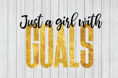 the words, just a girl with goals written in gold paint on a white wooden background