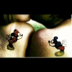 two people with mickey and minnie tattoos on their butts, one is wearing a red bow