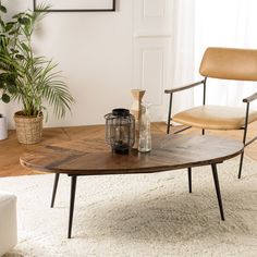 a living room with two chairs and a coffee table in the middle of the room