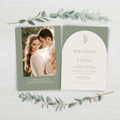 the wedding announcement card is shown with greenery