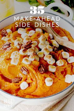 a white bowl filled with sweet potatoes and marshmallows on top of a table