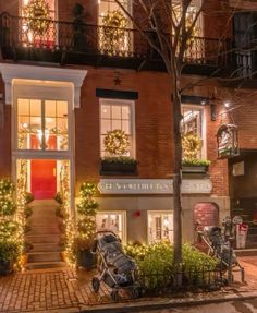 a building with christmas lights on the windows