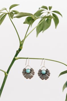 The Amazonite Fan earrings are made of sterling silver and feature an ancient green amazonite gemstone at its center. Simply slip on these one-of-a-kind dangling earrings and feel ready to head out. Handcrafted by artisans in Peru with Manos Amigas, meaning "hands joined in friendship," 20% of profits go to social efforts within their communities: warm meals to 300 children a day, school supplies and uniforms, and a scholarship program for artisans' children to attend university. Amazonite Drop Earrings As Gift, Green Sterling Silver Earrings With Oxidized Finish, Handmade Turquoise Amazonite Earrings, Turquoise Amazonite Dangle Earrings, Turquoise Dangle Earrings With Amazonite, Bohemian Amazonite Earrings As Gift, Bohemian Amazonite Earrings For Gifts, Nature-inspired Silver Earrings With Natural Stones, Handmade Amazonite Dangle Earrings