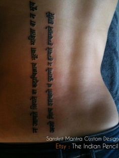 the back of a person's body with some writing on it