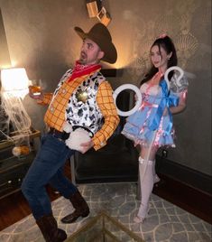 a man and woman dressed up in costumes