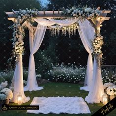 an outdoor wedding set up with white flowers and greenery on the lawn at night