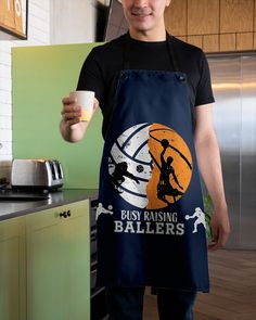 a man in an apron holding a cup