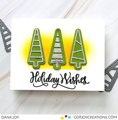 a card with three christmas trees on it and the words holiday wishes written in black ink