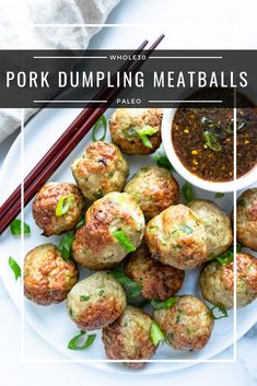 pork dumpling meatballs on a white plate with chopsticks and dipping sauce