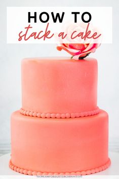 a pink cake with the words how to stack a cake on top