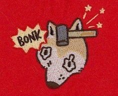 a dog with a hammer in its mouth and the word bonk on it's back