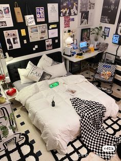 a bed sitting in a bedroom next to a black and white checkered rug