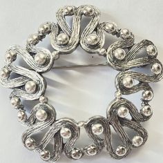 Vintage Tortolani Modernist Brooch, Large Silver Open Work Pin, Mid Century Jewelry, Gift for Her This is a mid century modernist brooch in silver signed Tortolani.   The 3" brooch has a scroll design with a beaded overlay. Wonderful vintage condition. More Brooches https://www.etsy.com/shop/VintageVogueTreasure?ref=hdr&search_query=Brooches Mid Century Jewelry, Saint James, Scroll Design, Vintage Vogue, Vintage Brooches, Jewelry Gift, Beautiful Necklaces, Favorite Jewelry, Sterling Silver Jewelry