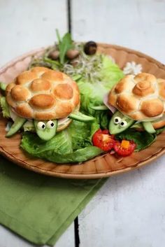 two sandwiches with googly eyes on top of lettuce