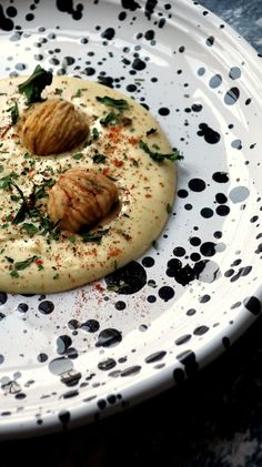 a white plate topped with food on top of a table