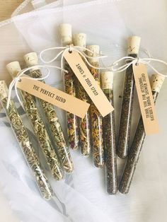 several different types of herbs are wrapped in cellophane