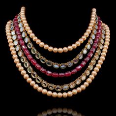 Add a hint of glamour to your style in this standout mala necklace! Beautifully crafted mala featuring strands of pearl beads put together with ruby and kundan stones. Approximate mala length is. Gold-plated on high-quality brass as base metal. Made by order. Kindly allow 5-7 weeks for the delivery of this item. For custom or urgent requests, please contact support@alacouture.com. *Please Note: We use faux stones and beads in all of our jewelry. Gold Kundan Mala With Polished Beads, Gold Kundan Necklace With Gemstone Beads, Bollywood Kundan Necklace With Polished Beads For Diwali, Diwali Kundan Necklace With Polished Beads, Temple Jewelry Style Pearl Beaded Necklaces For Festivals, Temple Style Pearl Beaded Necklaces For Festivals, Festival Pearl Beaded Temple Jewelry Necklace, Festival Kundan Pearl Necklace With Round Beads, Kundan Necklace With Beaded Chain For Festivals