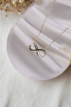 ABOUT PRODUCT 14K Gold Infinity Necklace, Gift for Her, Dainty Pendants, Minimalist jewelery,Women Necklace This 14K gold infinity  necklace is beautifully designed and hand crafted with our associates to make this a special gift for your loved ones. Knowing the value of our customers. We prepare each piece with extra care and attention. ITEM DETAILS Material: 14K Gold Approx: 2,90 gr Available colors: Gold, Rose Gold, White Gold Available Sizes: 14" to 20" ★ 14k Solid Gold (Certification will b Gold Infinity Necklace, Infinity Necklace Gold, Necklace Infinity, Gold Animals, Infinity Pendant, Zierlicher Ring, Stacked Necklaces, Solid Gold Necklace, Dainty Pendant