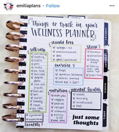 a planner that has the words, things to track in your wellness planner